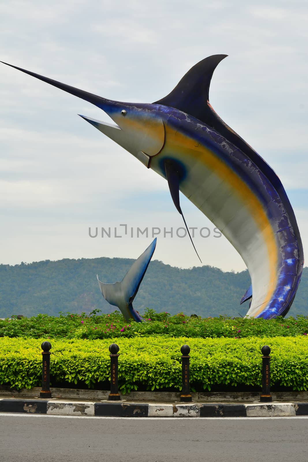 KOTA KINABALU, MY - JUNE 21: Swordfish statue on June 21, 2016 in Kota Kinabalu, Malaysia. Swordfish statue is located on a small roundabout, next to the Hyatt Regency Kinabalu, in Kota Kinabalu.