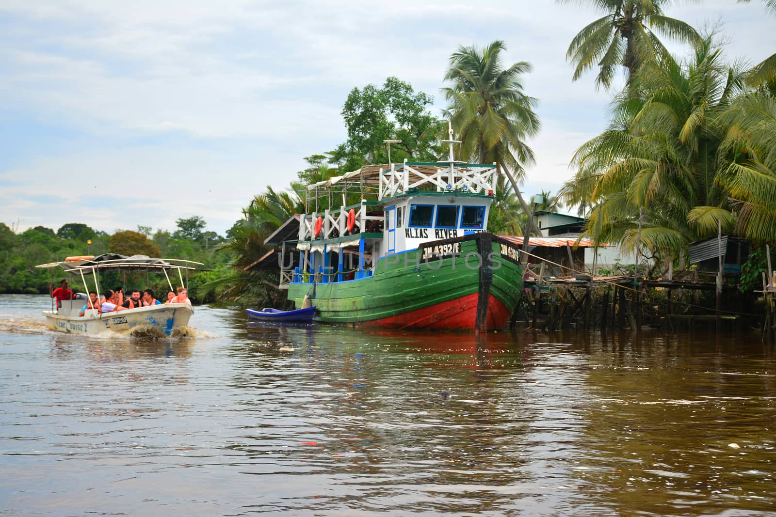 SABAH, MY - JUNE 20: Klias River and boat on June 20, 2016 in Sabah, Malaysia. Klias river is a Mangrove Forest Reserve and a ecotourism destination wherein you can see proboscis monkey in the trees.