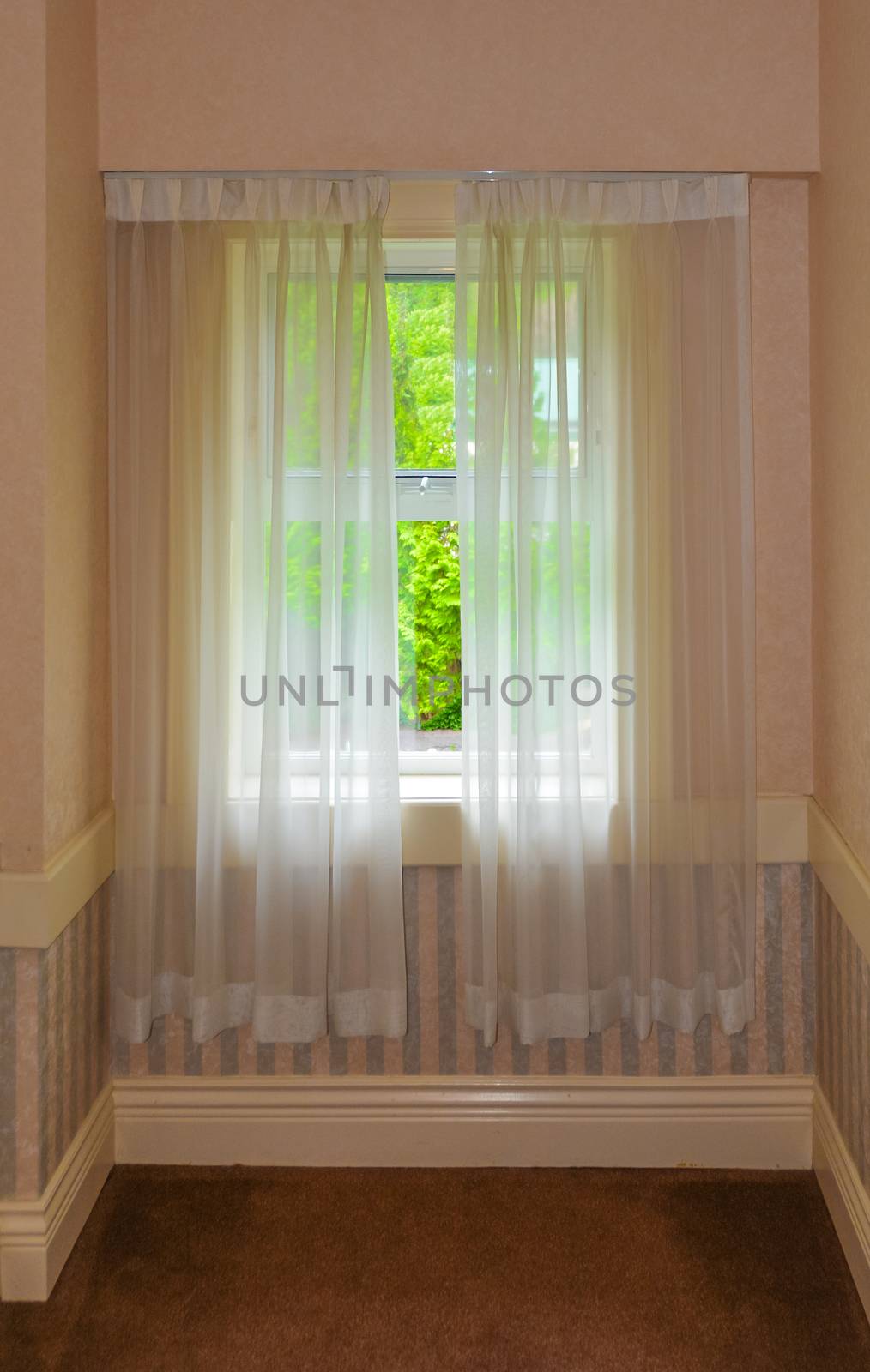 Semi transparent valance on a window in a house