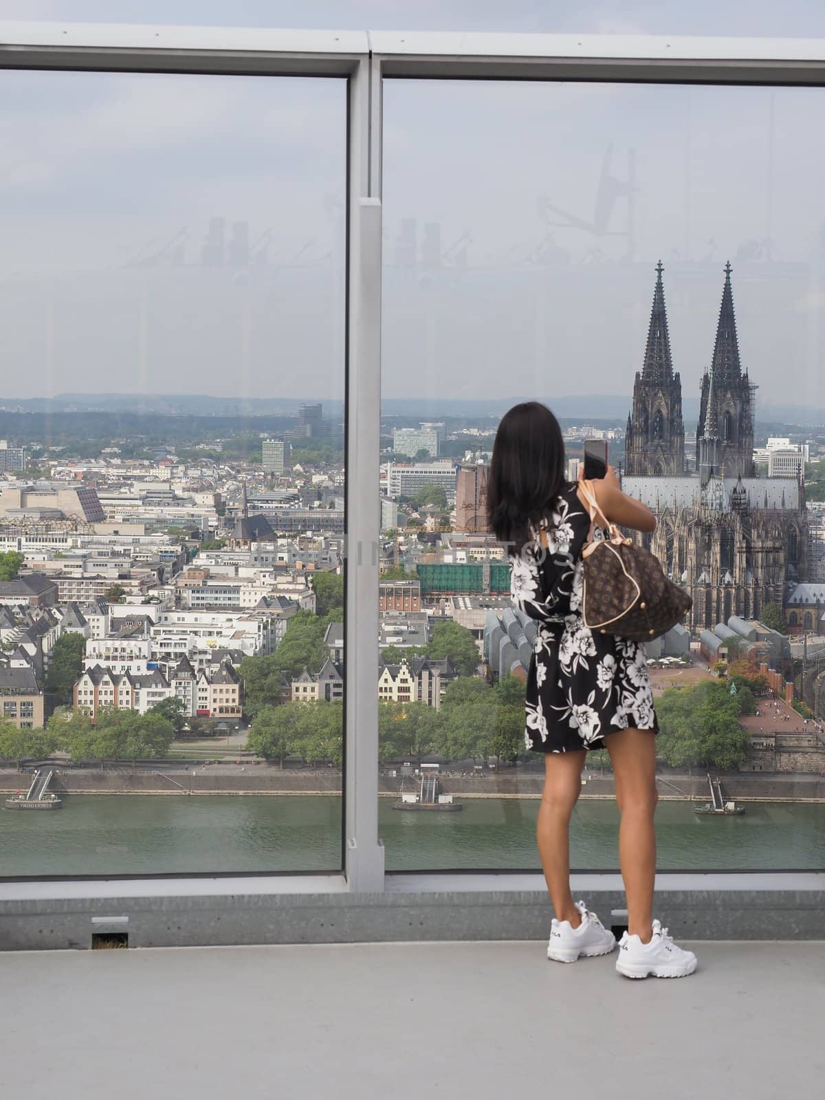 KOELN, GERMANY - CIRCA AUGUST 2019: People on Koelntriangle skyscraper sightseeing watching platform