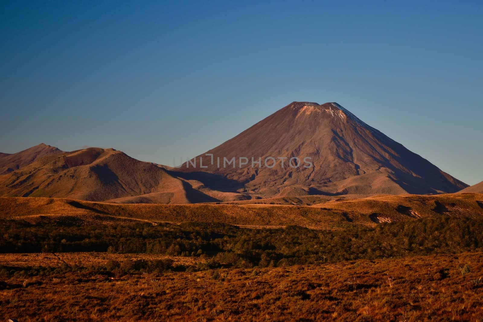 Symmetrial cone of a volcano (Mt Ngauruhoe) at Tongariro National Park, New Zealand. This is the largest and most active volcano of the Tongariro group, part of the Pacific Ring of Fire. by Marshalkina