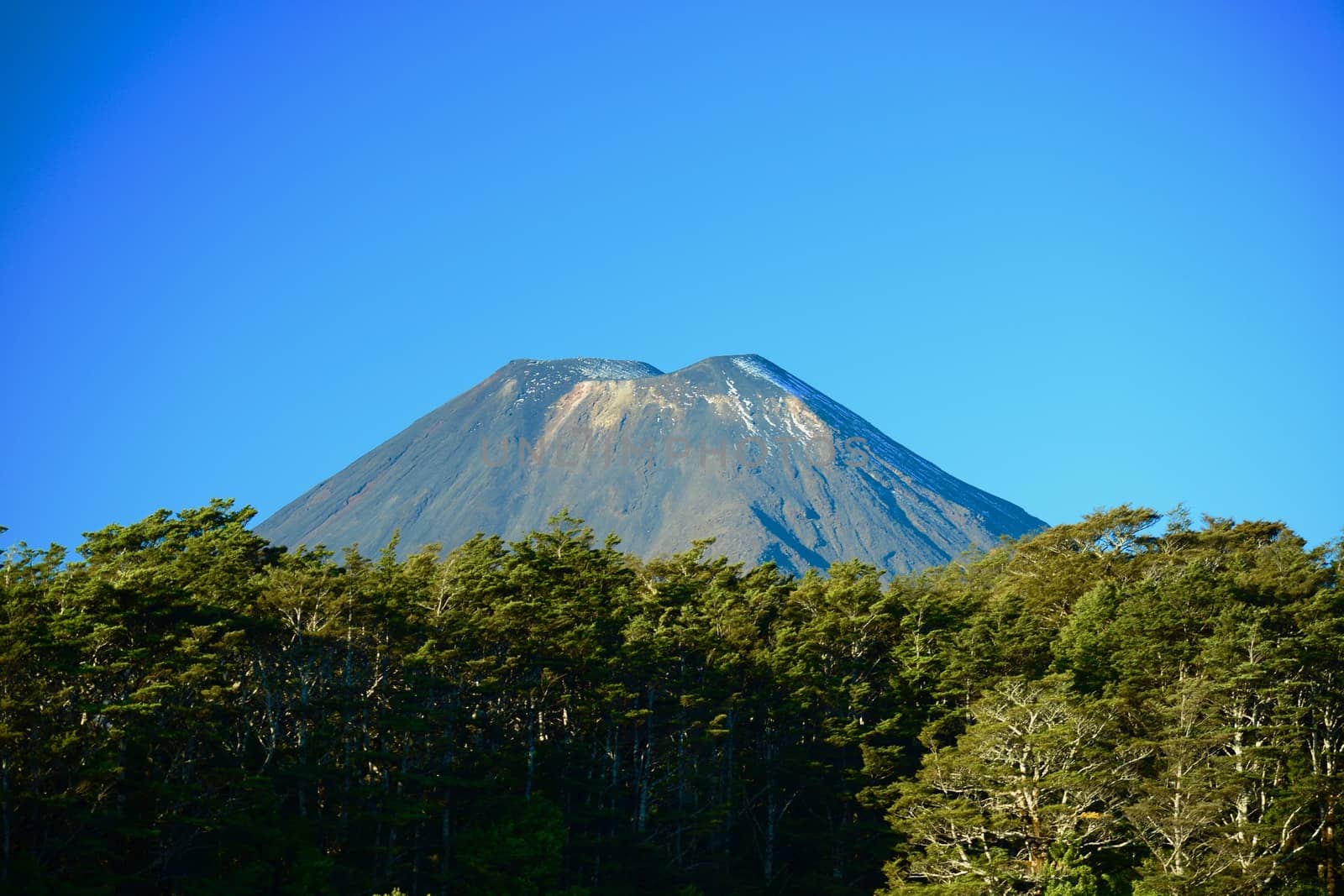 Symmetrial cone of a volcano (Mt Ngauruhoe) at Tongariro National Park, New Zealand. This is the largest and most active volcano of the Tongariro group, part of the Pacific Ring of Fire. by Marshalkina