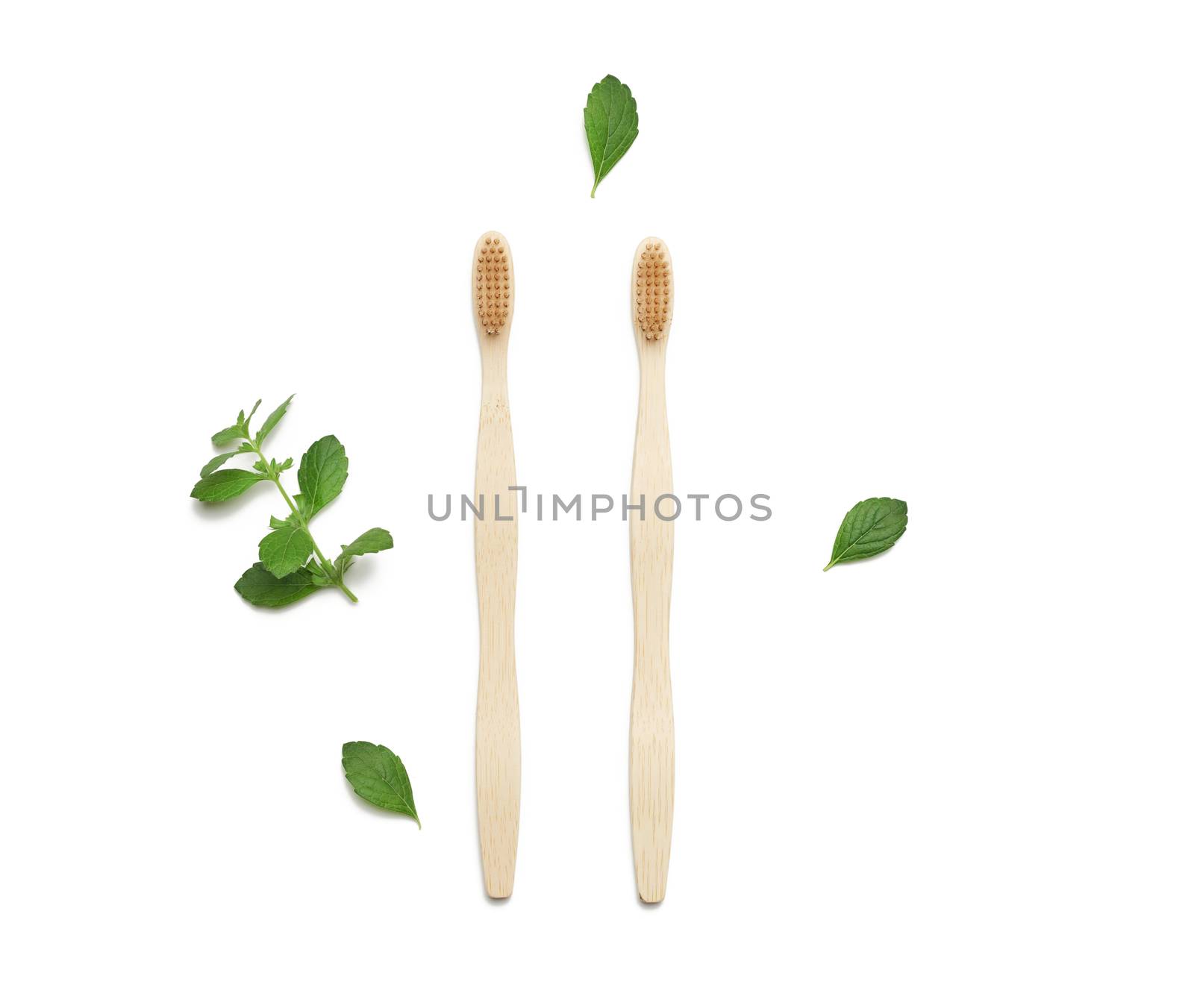 two wooden toothbrushes on a white background, plastic rejection concept, zero waste 