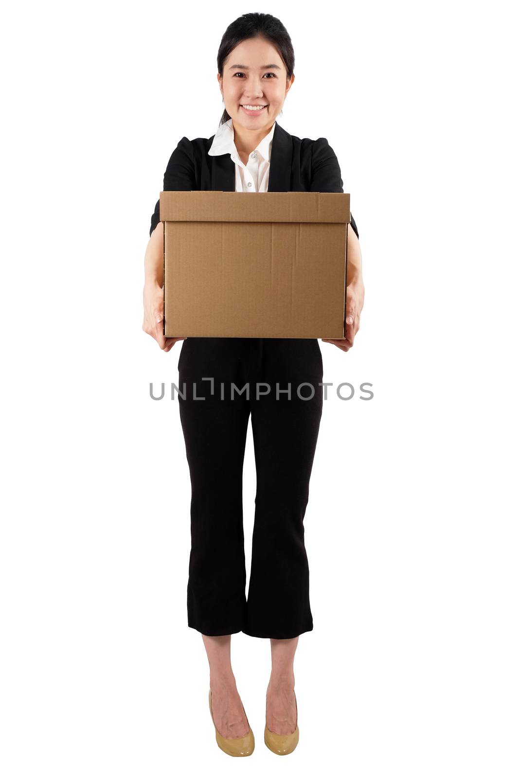 A young woman carrying a box