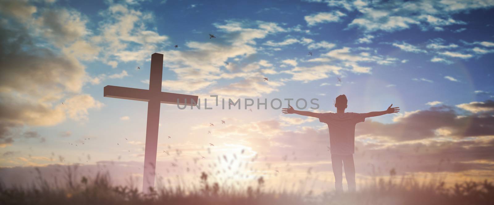 Happy man rise hand Worship God in morning view. Christian spirit prayer praise on good friday cross background. Male self confidence empowerment on mission arm concept strength ambitious