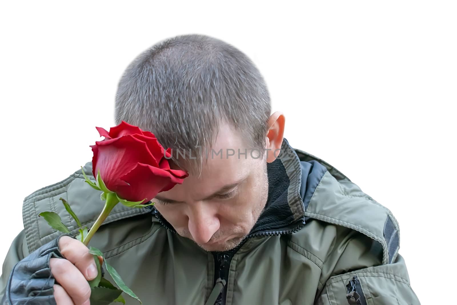 a red rose flower in the hand of a sad guy in leather gloves on a white isolated background
