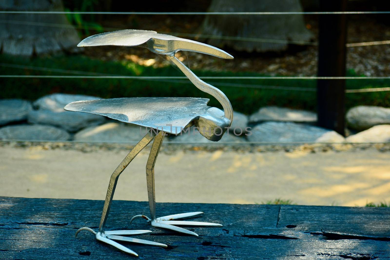 Matakana, New Zealand - Dec 2019: Sculptureum sculpture park. Peculiar modern sculpture made of various gardening tools representing a bird. by Marshalkina