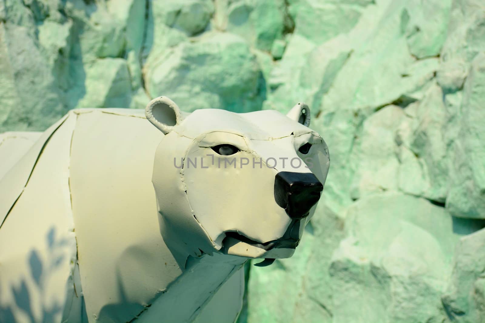 Modern garden sculpture; white bear made of broken washing machine parts