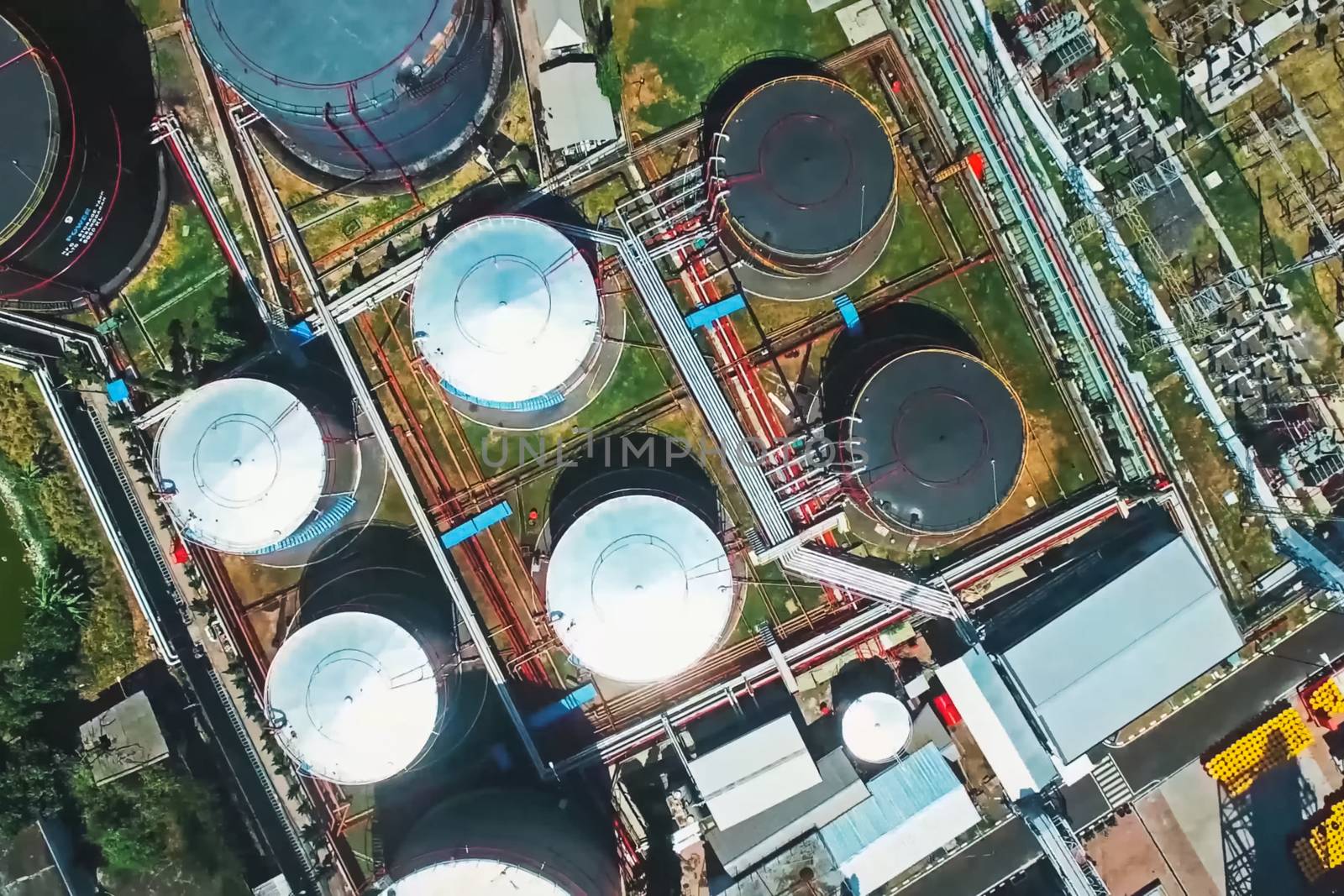 Oil tanks at an oil refinery. by DePo