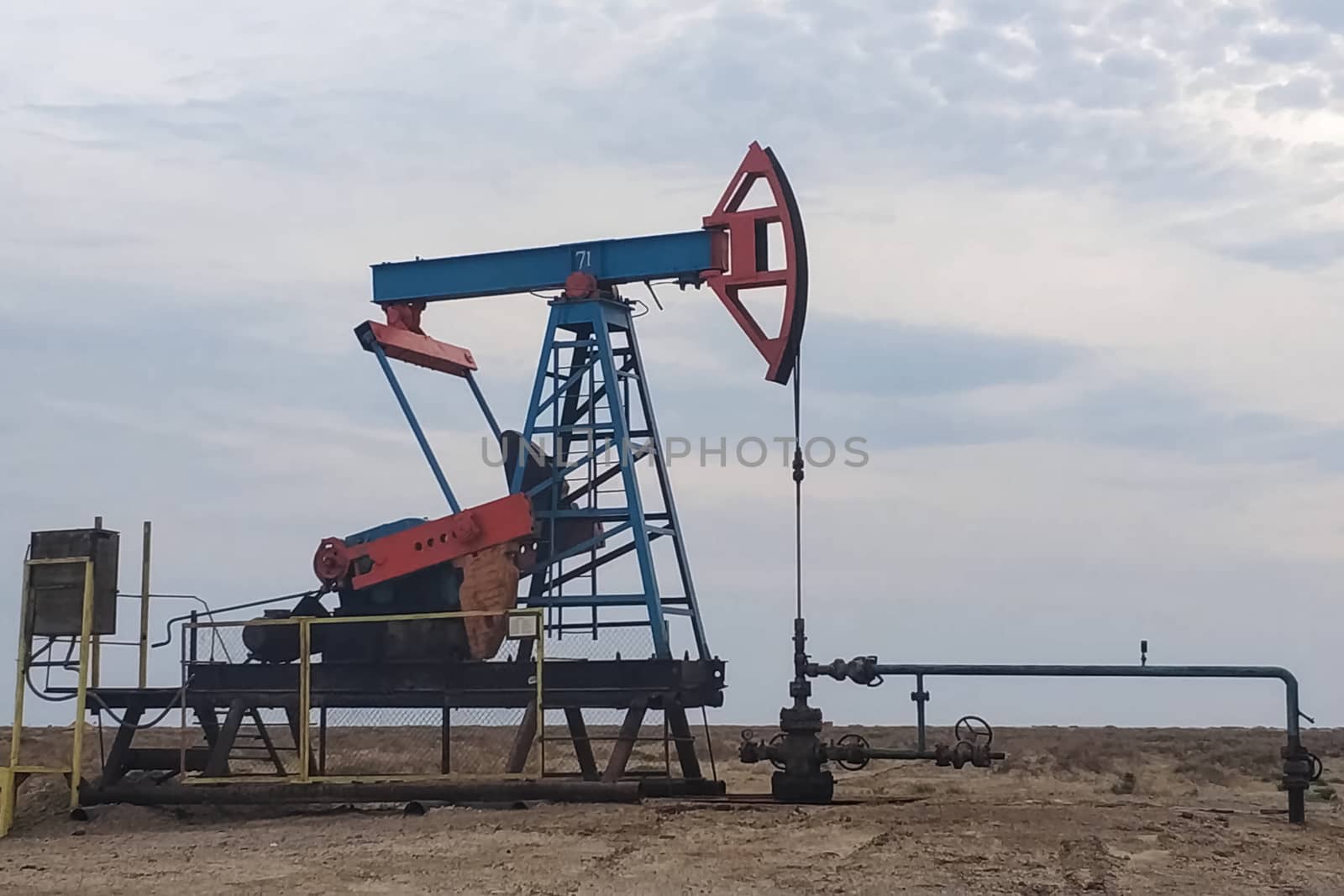 A rocking machine on an oil well. Oil production.