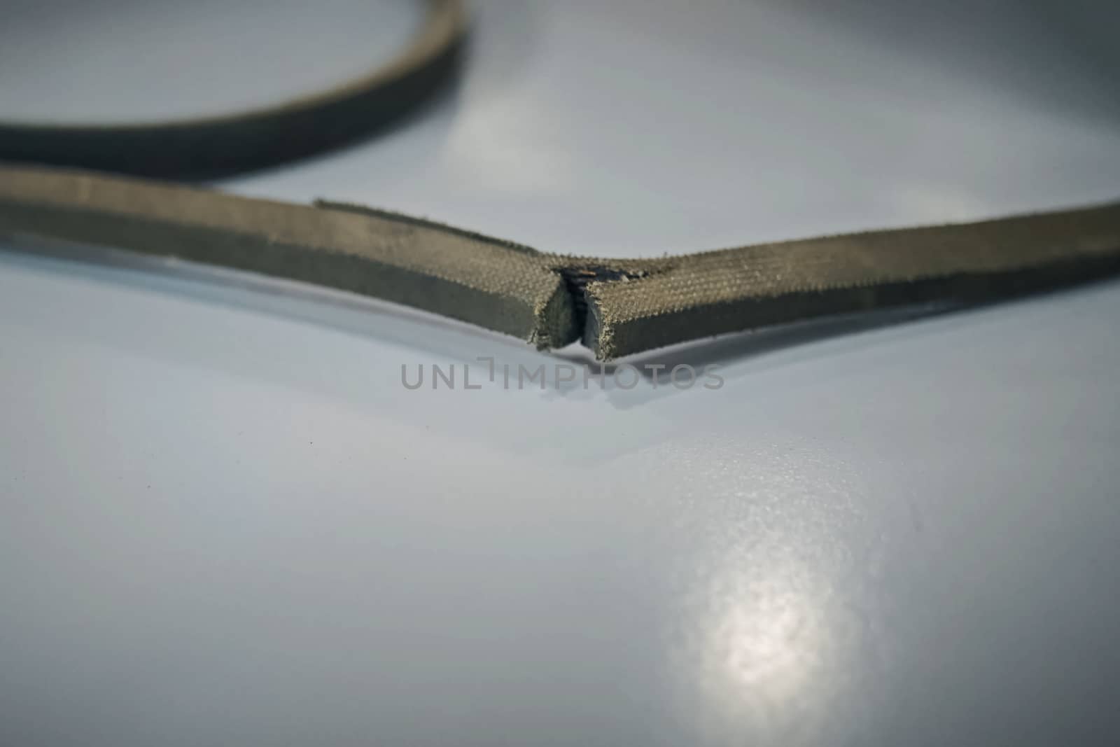 torn rubber belt of belt transmission. by DePo