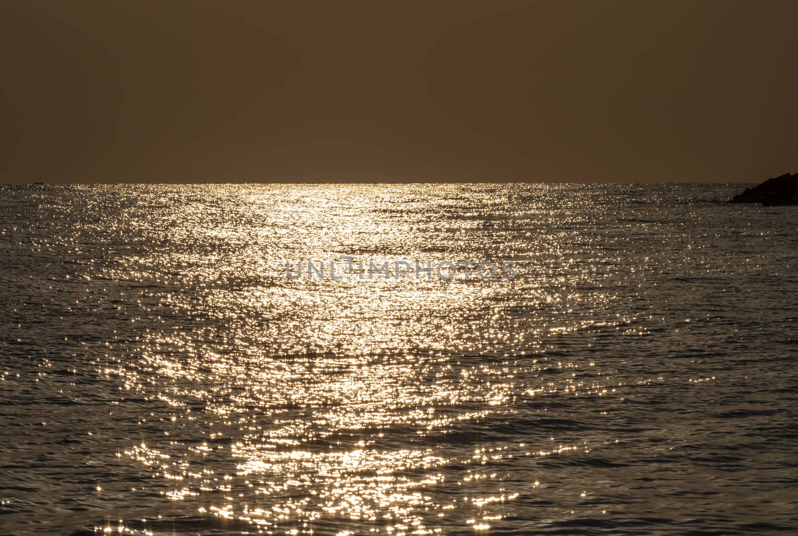 Early morning, dramatic gold sunrise over sea
