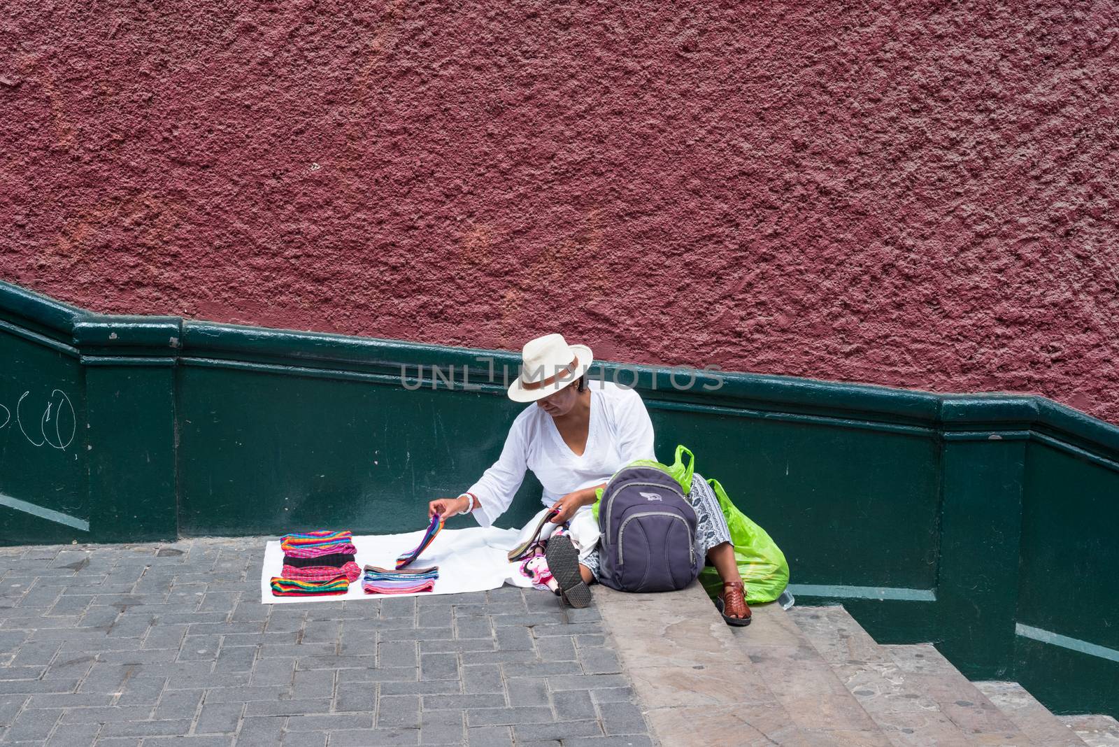 Lima, Peru -- April 13, 2018. A street vendor displays scarves for sale on stairs near the Bridge if Sighs. Editorial use only.