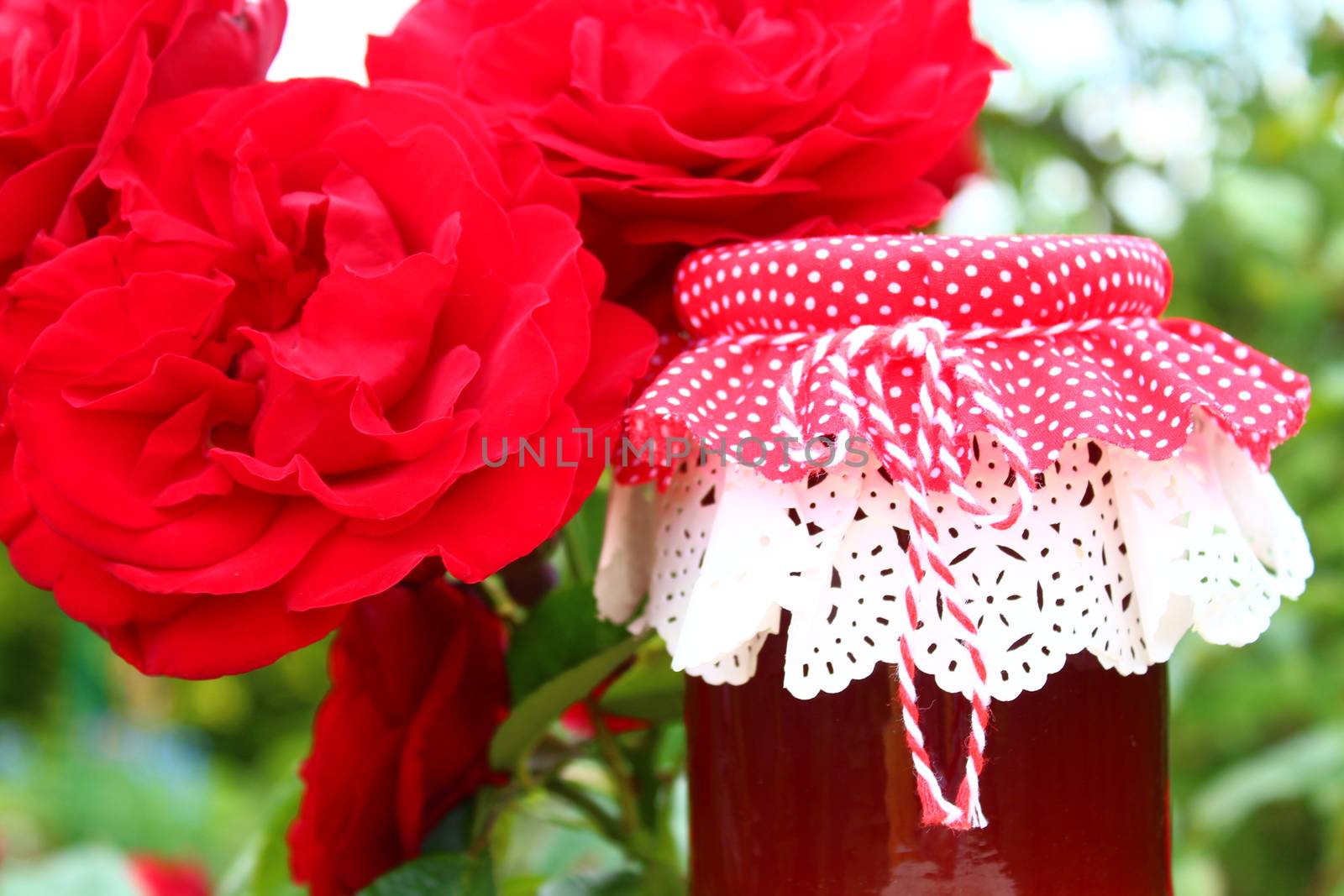 rose jelly and blossoming roses by martina_unbehauen