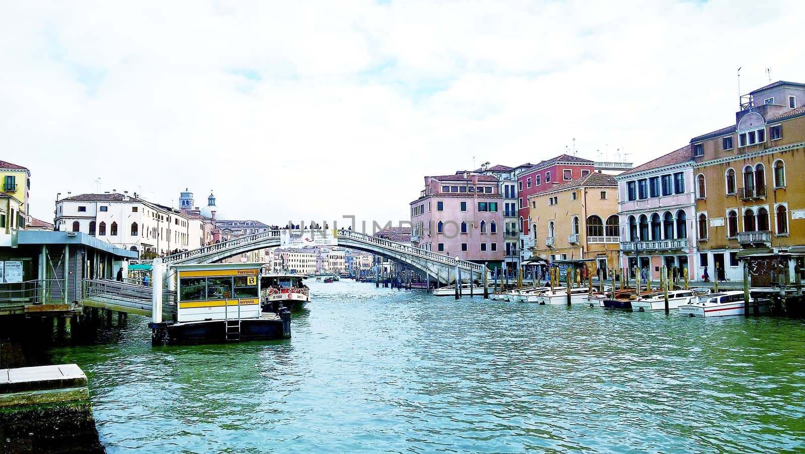 Venice, Italy - 04/24/2019: Foggy (misty) Venice. Canal (channel), historical, old houses and gondoliers with gondolas in thick fog. Scenic cityscape view. Venice. Italy. Copy space. Empty place for message. Outdoor.