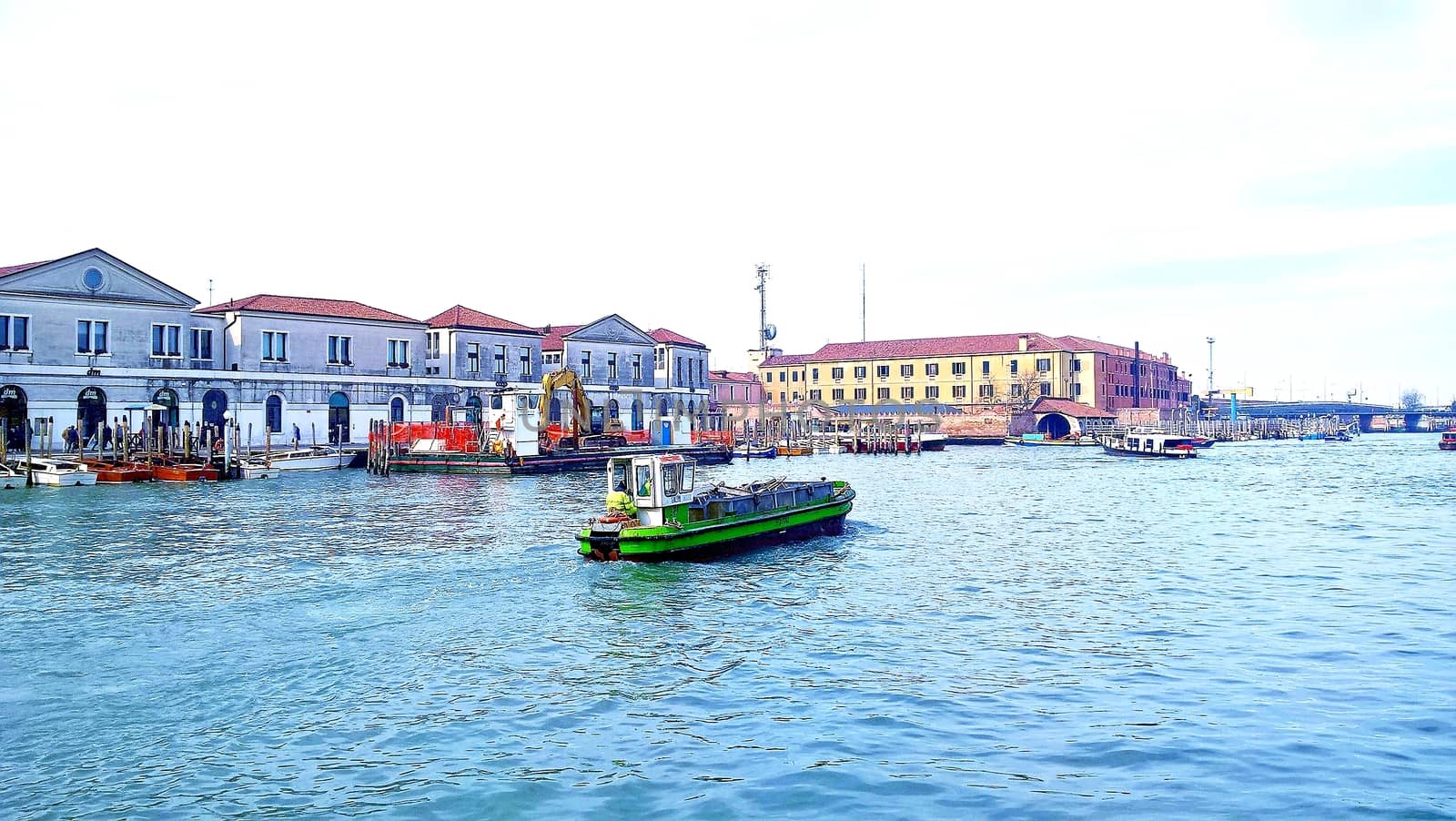 Venice, Italy - 04/24/2019: Foggy (misty) Venice. Canal (channel), historical, old houses and gondoliers with gondolas in thick fog. Scenic cityscape view. Venice. Italy. Copy space. Empty place for message. Outdoor.