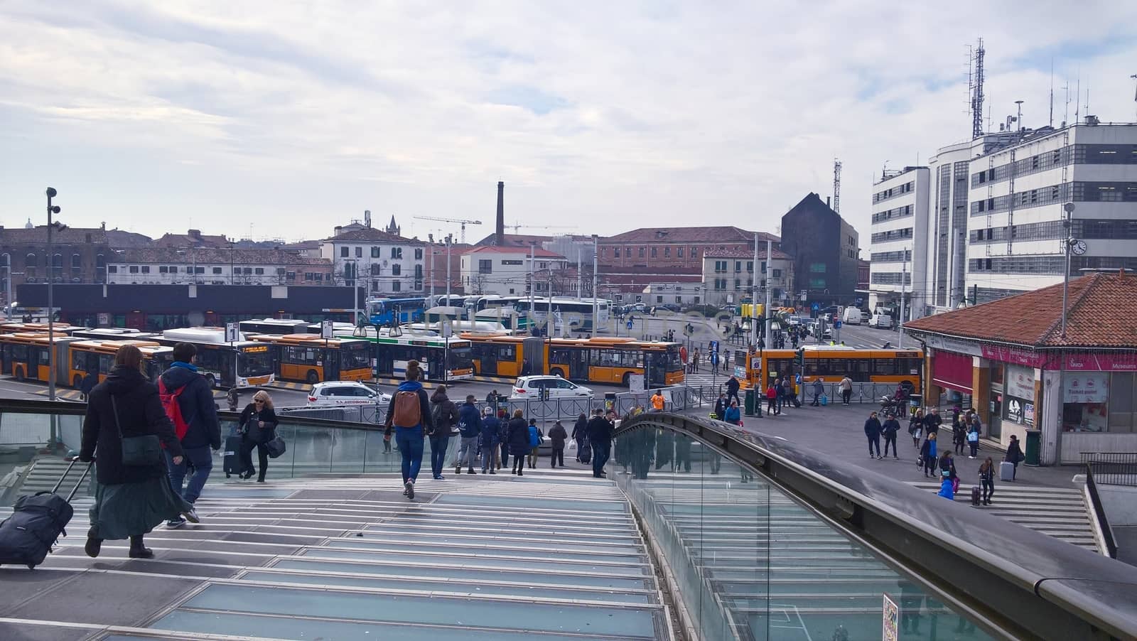 Venice, Italy - 04/24/2019: Foggy (misty) Venice. Canal (channel), historical, old houses and gondoliers with gondolas in thick fog. Scenic cityscape view. Venice. Italy. Copy space. Empty place for message. Outdoor.