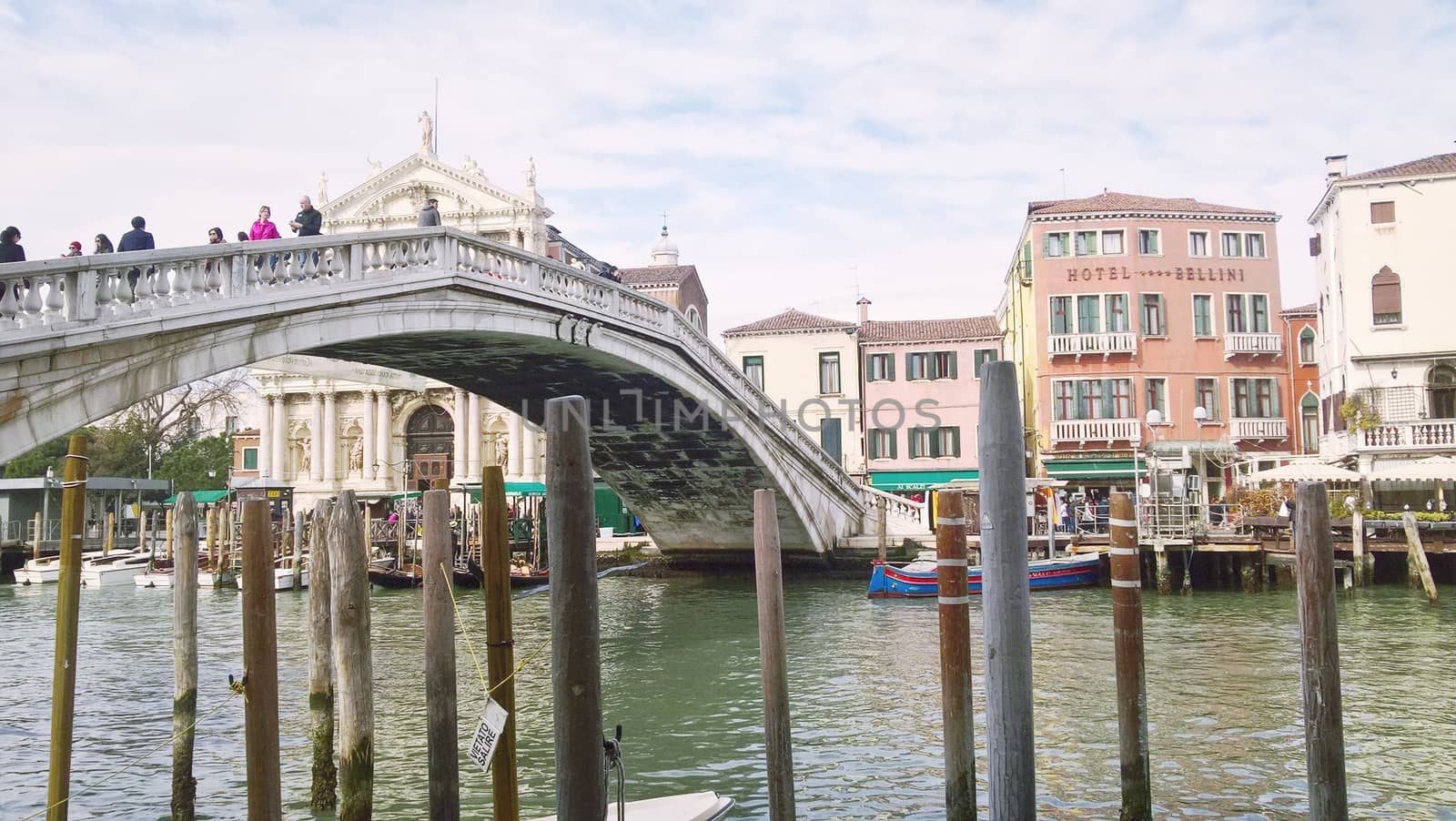 Venice, Italy - 04/24/2019: Foggy (misty) Venice. Canal (channel), historical, old houses and gondoliers with gondolas in thick fog. Scenic cityscape view. Venice. Italy. Copy space. Empty place for message. Outdoor.