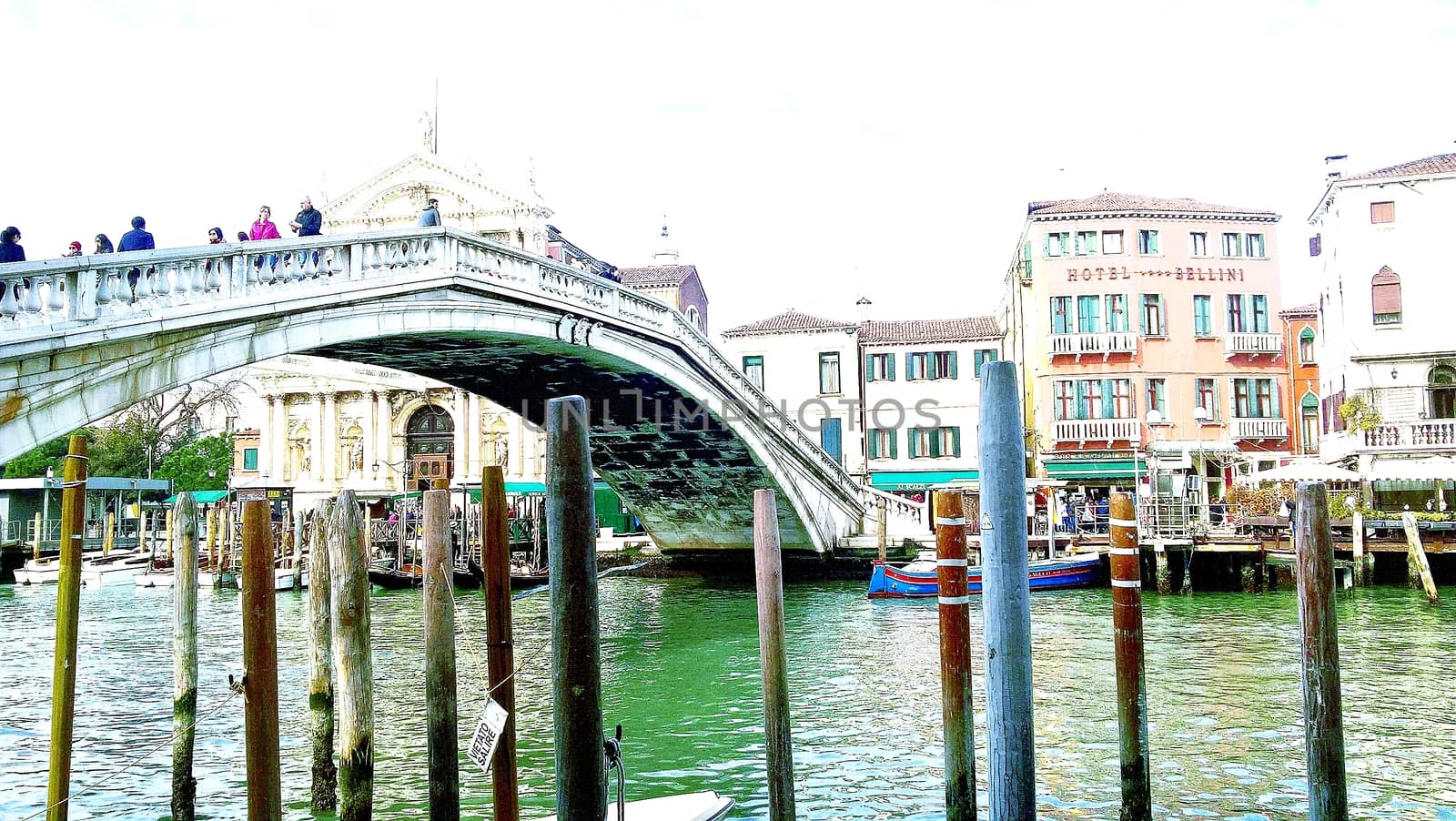 Venice, Italy - 04/24/2019: Foggy (misty) Venice. Canal (channel), historical, old houses and gondoliers with gondolas in thick fog. Scenic cityscape view. Venice. Italy. Copy space. Empty place for message. Outdoor.