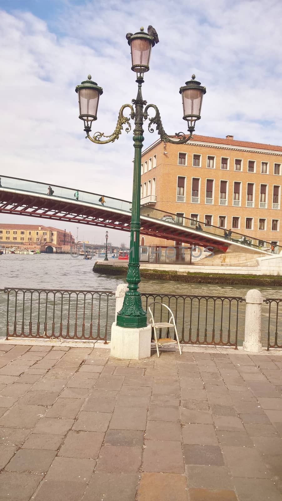 Venice, Italy - 04/24/2019: Foggy (misty) Venice. Canal (channel), historical, old houses and gondoliers with gondolas in thick fog. Scenic cityscape view. Venice. Italy. Copy space. Empty place for message. Outdoor.