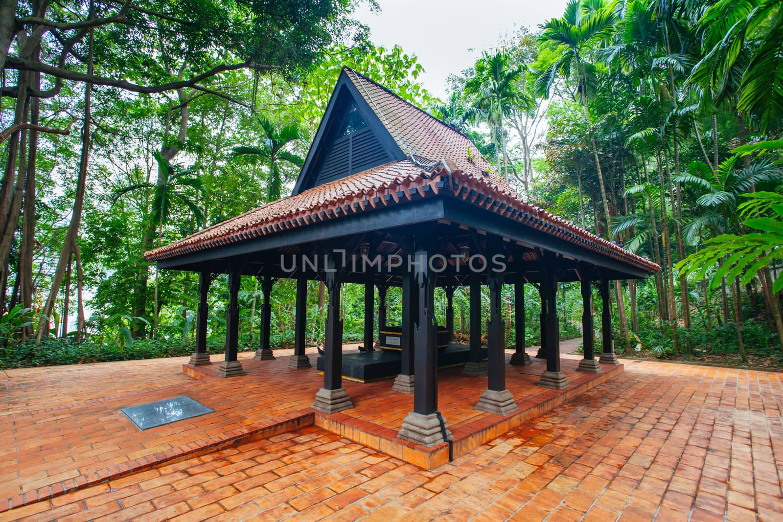 Keramat Iskandar Syah and the surrounds of Fort Canning Park in Singapore City on a warm humid morning.