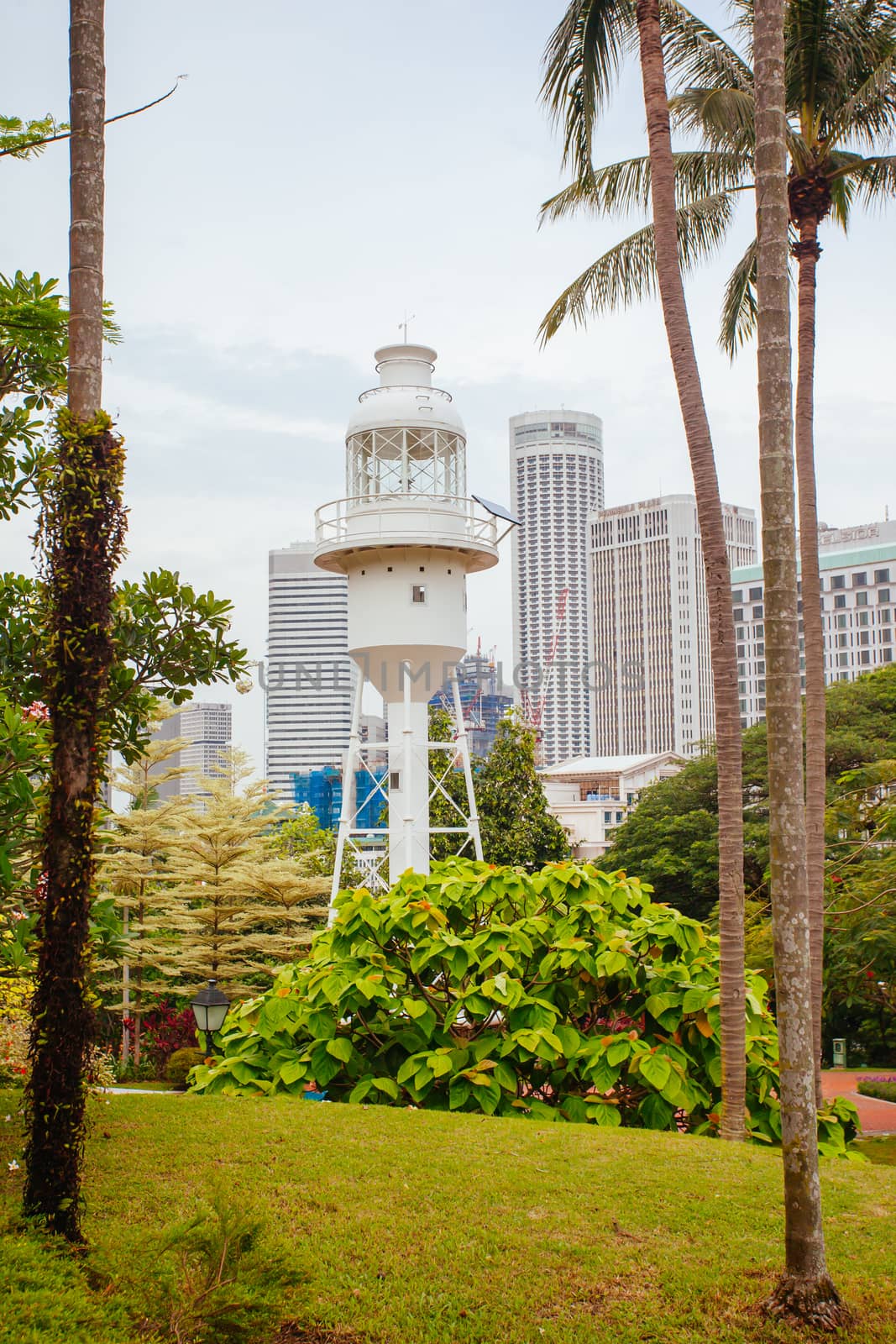 Fort Canning Lighthouse in Fort Canning Park in Singapore City on a warm humid morning.