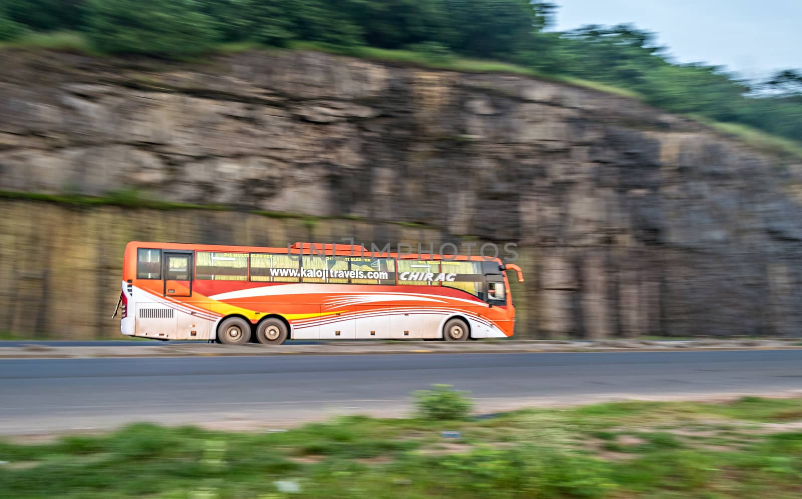 Pune, Maharashtra, India - September 26, 2017 : Chirag travels AC bus , speeding towards Mumbai on highway.