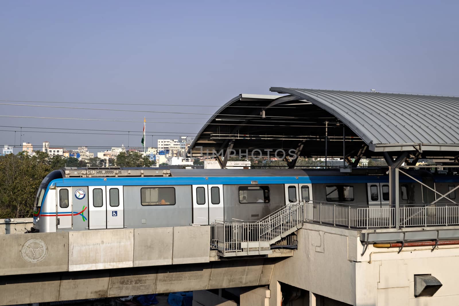 Rapid transit Hyderabad metro train exits Nampally station in the morning. The service has successfully completed one year in 2019