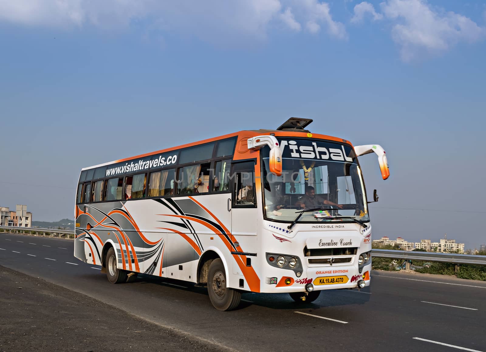 Pune, Maharashtra, India- October 25th, 2016: Vishal travels bus speeding on highway.