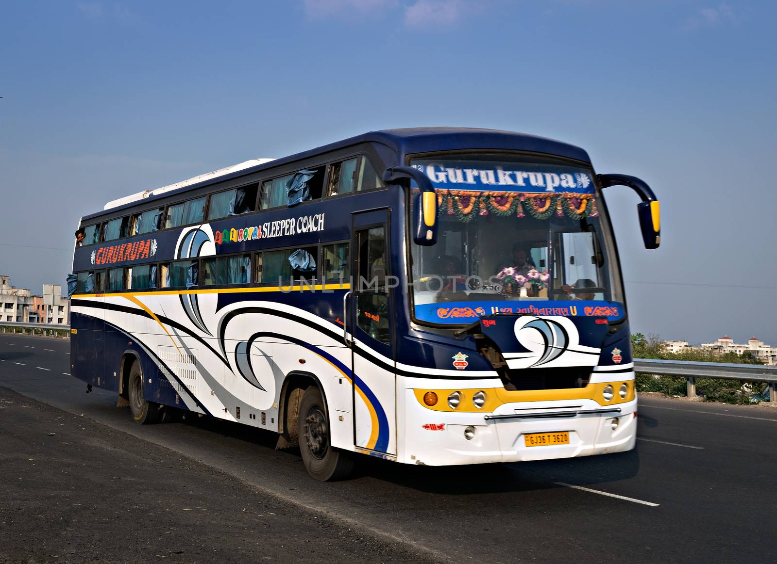 Pune, Maharashtra, India- October 25th, 2016:Gurukripa transport bus speeding on highway. by lalam