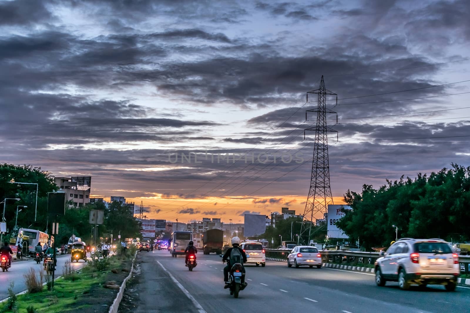 Pune, india:June 18th, 2018-Beautiful evening sky pattern on a rainy day on road around Sunset. by lalam