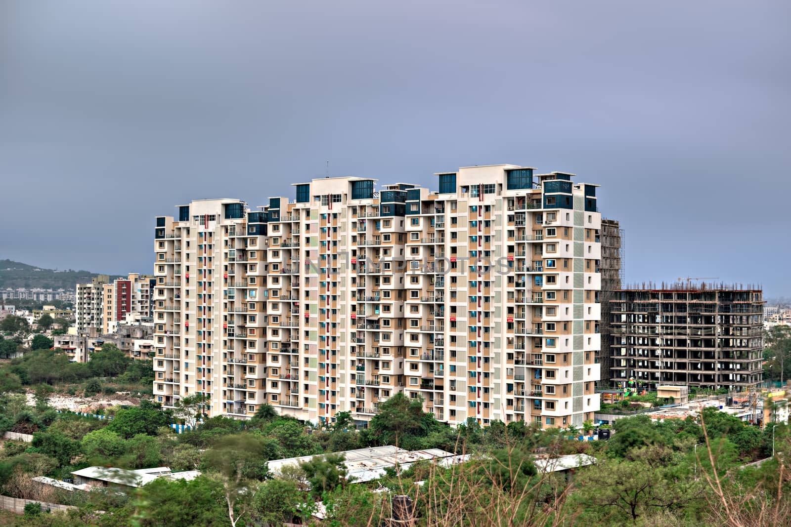 Pune, Maharashtra, India - June 19th, 2018 : High-rise building with beautiful clouds backgroundin a fast  developing city-Pune.