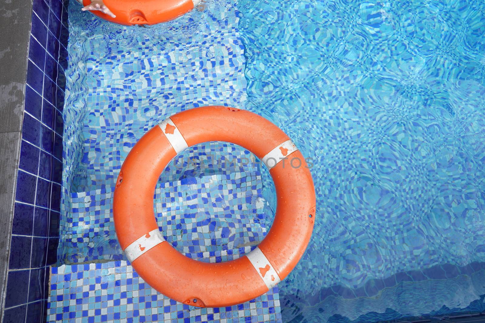 Safety equipment, life buoys, or rescue red buoys in the pool to by noppha80