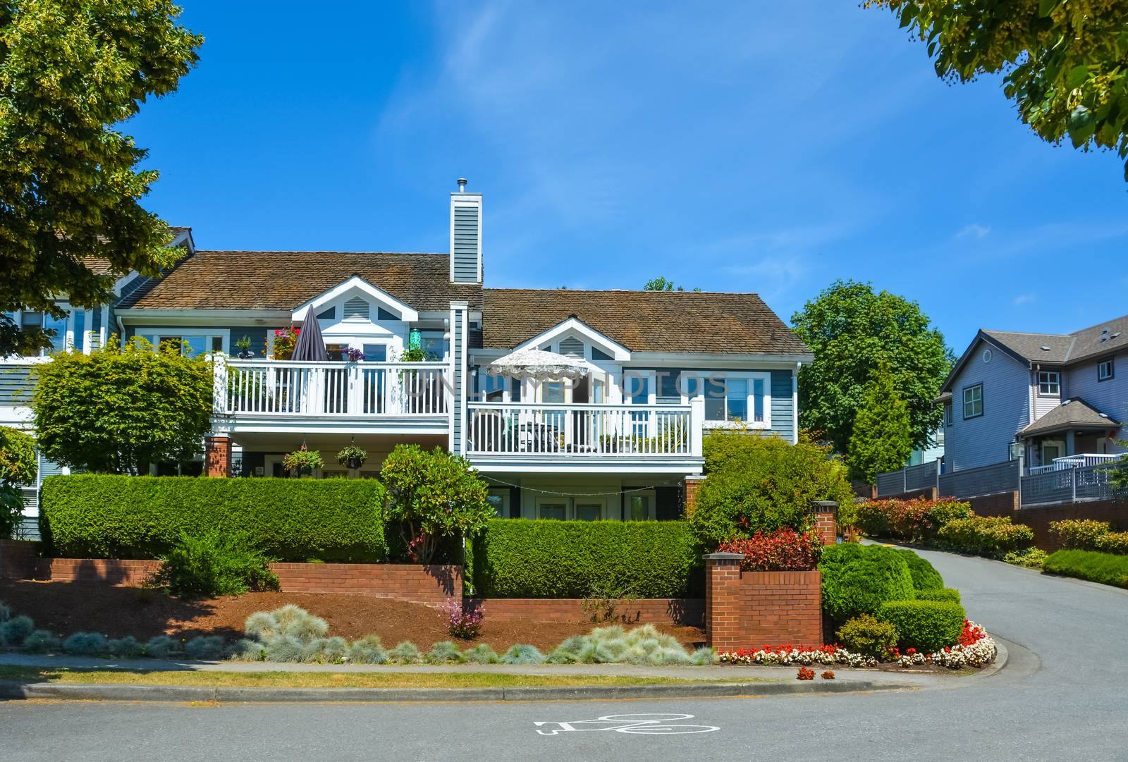 Beautiful attached houses on blue sky background in British Columbia, Canada