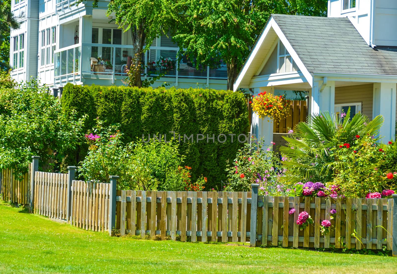 Entrance of residential apartment building on bright sunny day in Vancouver, British Columbia