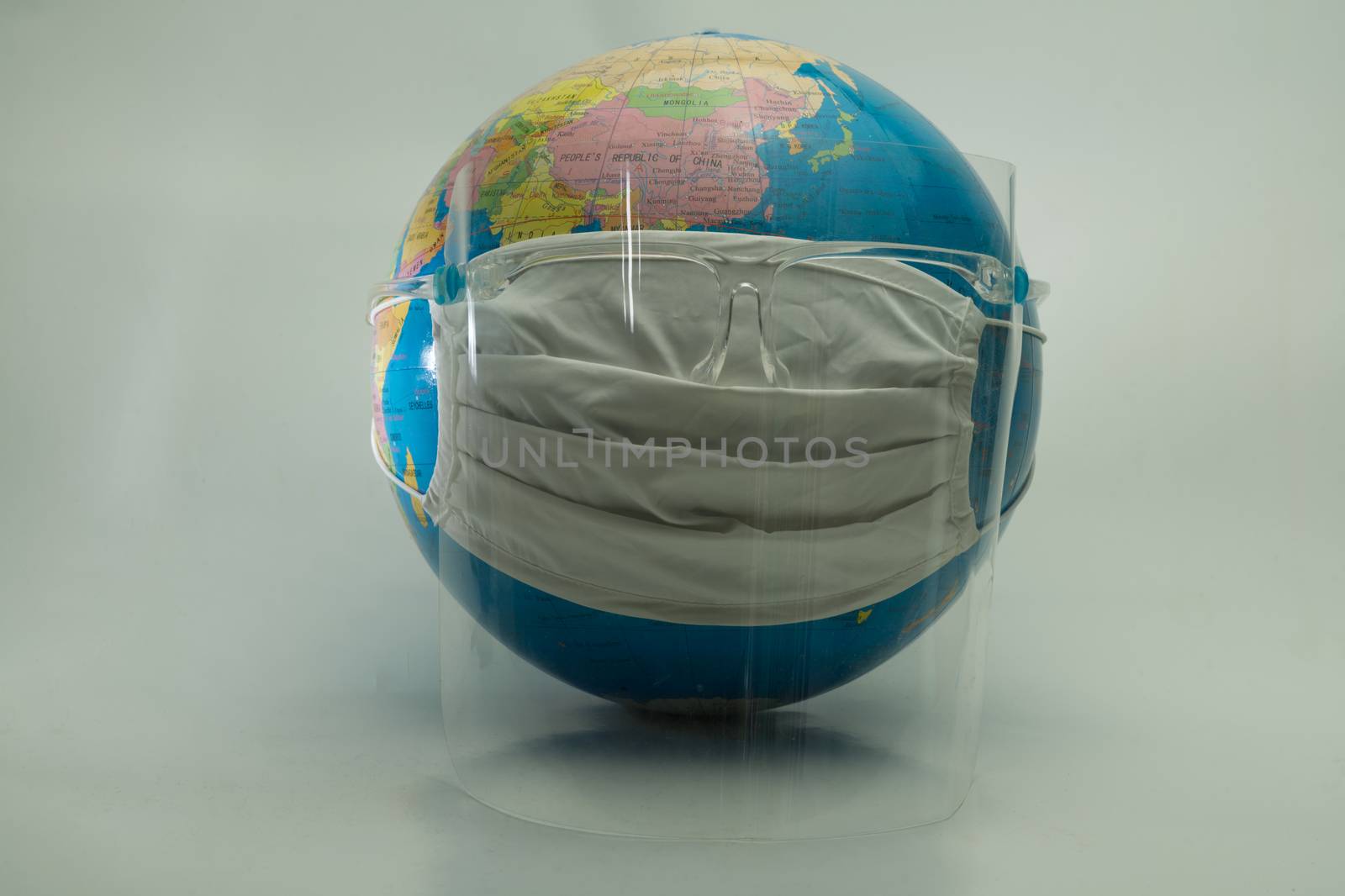 Globe simulates wearing medical masks to prevent the outbreak of by noppha80