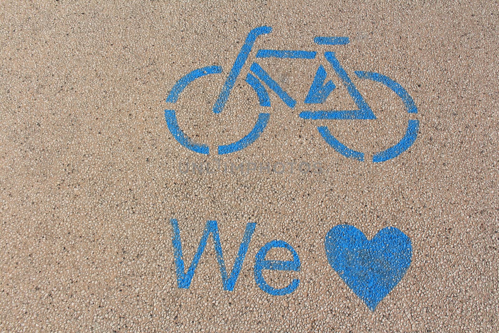 Blue marked bike path on Lake Garda in Italy.