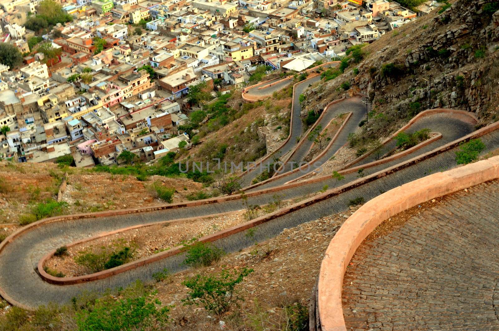 Curving winding road leading to Nahargarh Fort in Jaipur giving the view of the whole city in Rajasthan, India. The fort was constructed as a place of retreat on the summit of the ridge above the city