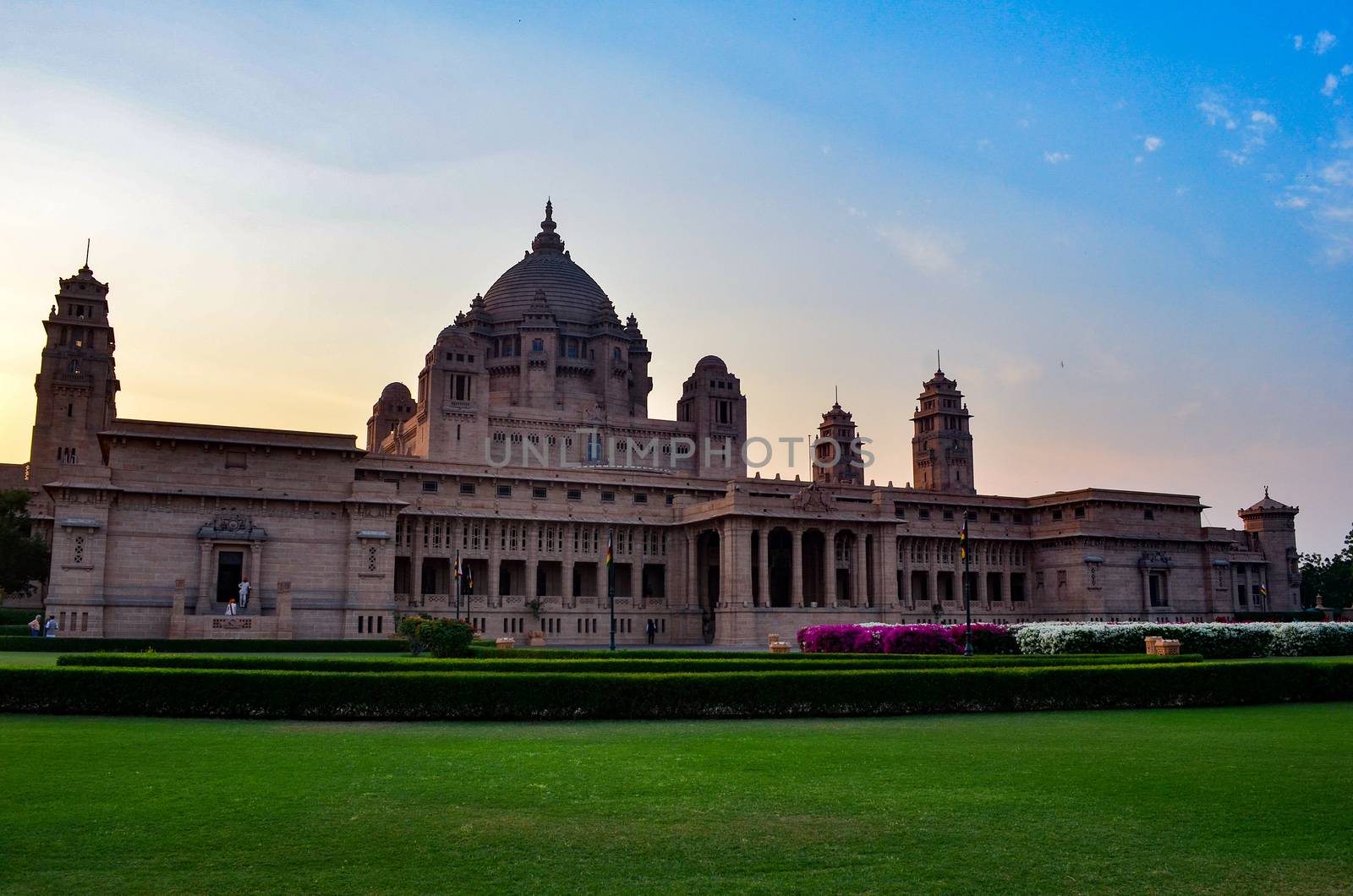 Majestic view of the Umaid Bhawan palace and hotel against a setting sun in Jodhpur, Rajasthan, India. This elegant hotel in a grand building was once home to the Jodphur royal family.