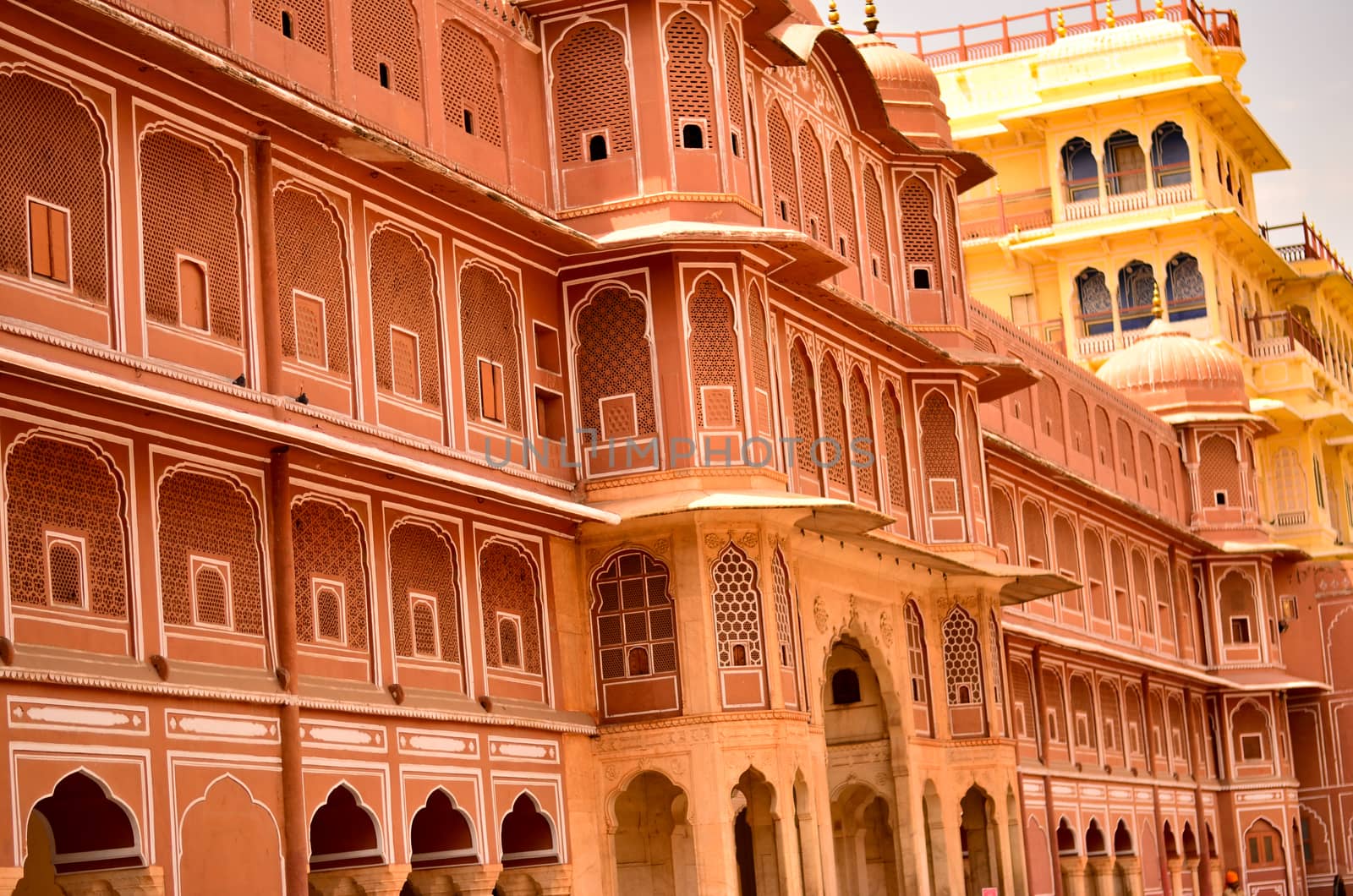 Wall section of City Palace, which includes the Chandra Mahal and Mubarak Mahal palaces and other buildings, is a palace complex in Jaipur, the capital of the Rajasthan, India. by jayantbahel