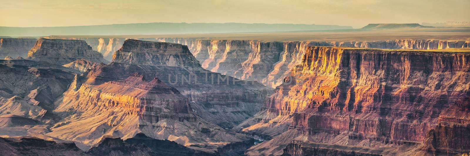 Grand Canyon banner nature landscape steep cliffs at sunset dusk panoramic background.