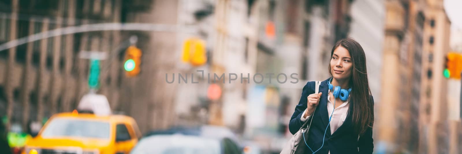 New York City lifestyle Young Asian woman walking commute in NYC street. Urban people hipster girl in traffic banner panorama. Chinese lady looking to side with purse and headphones for commute.