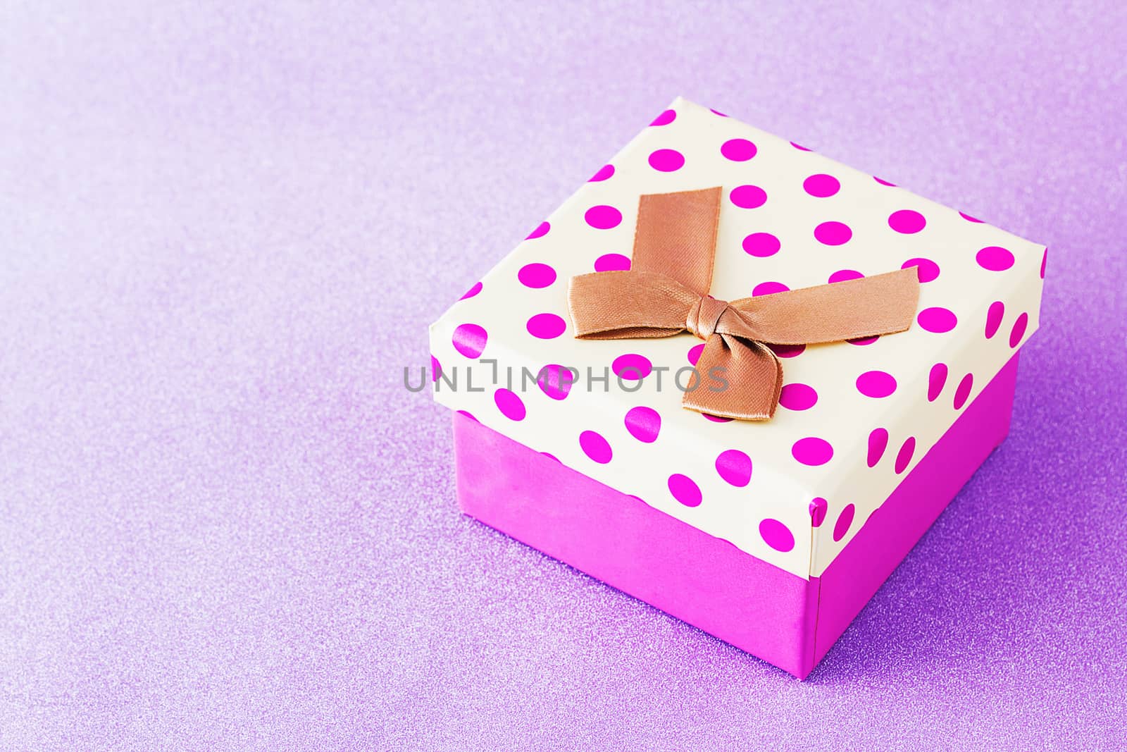 Colorful gift box on pink background, christmas, happy new year, birthday, valentine concept