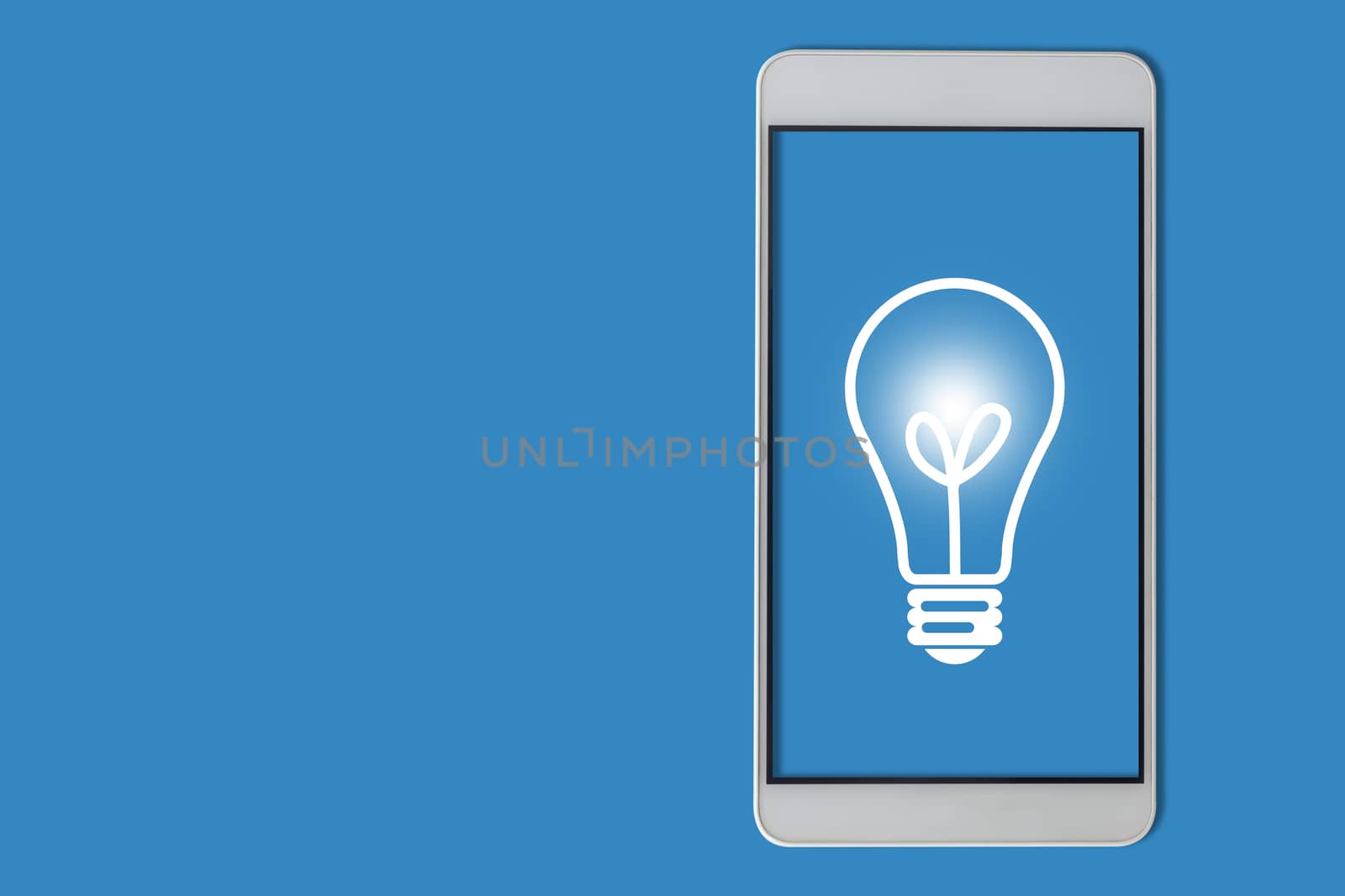 Idea and inspiration concept, business creativity, light bulb and mobile phone on blue background