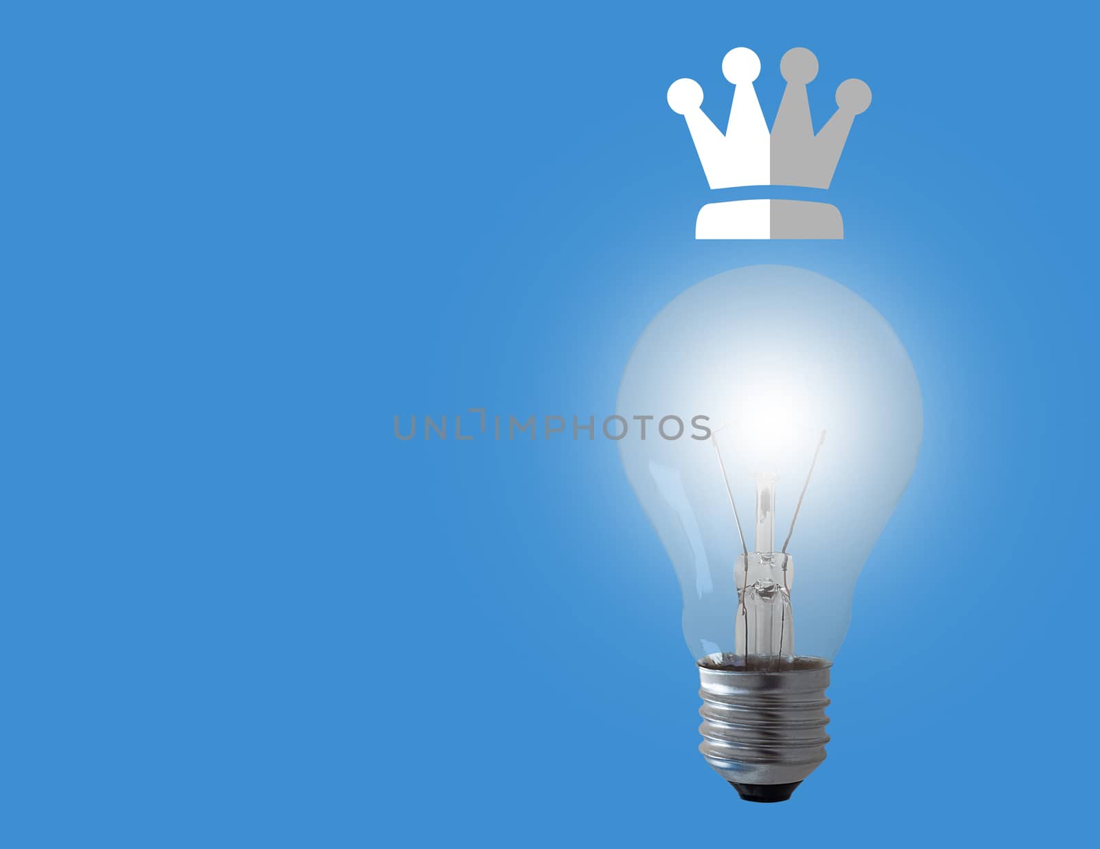 Think big concept, light bulb and crown on blue background, business leadership