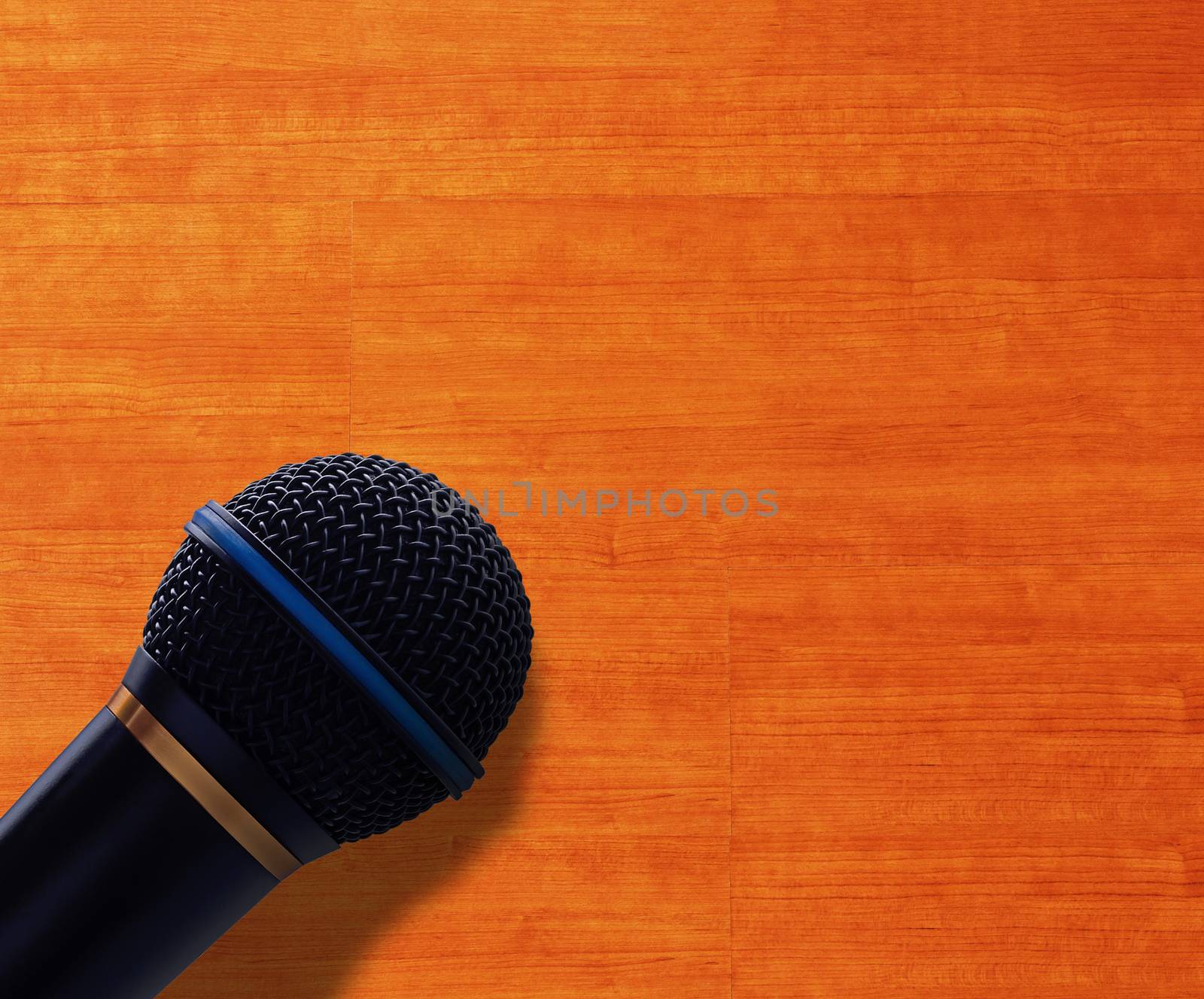 Journalist interview concept, speak microphone on wood background