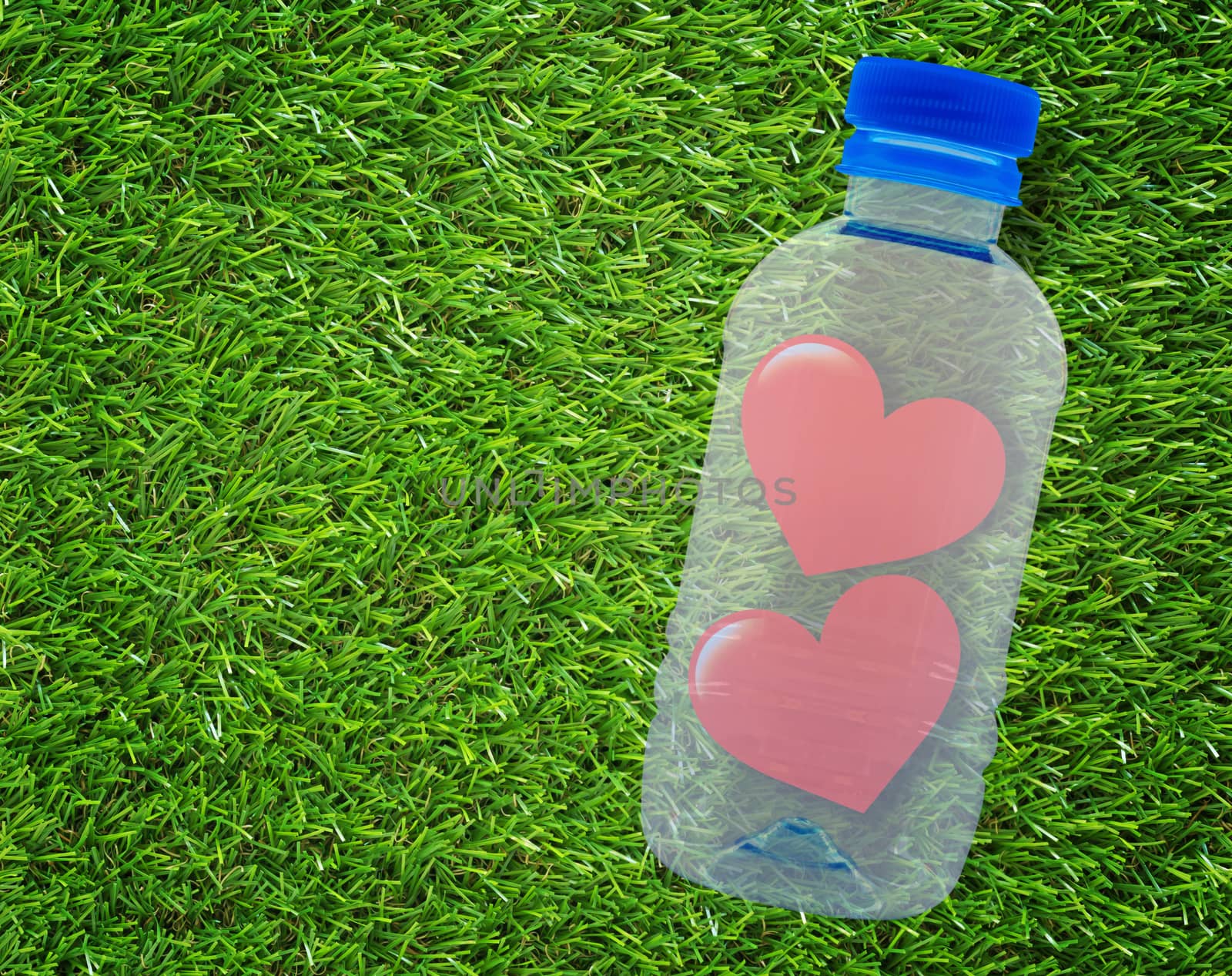 Two red paper hearts on green grass background, valentine day, romantic and falling in love concept