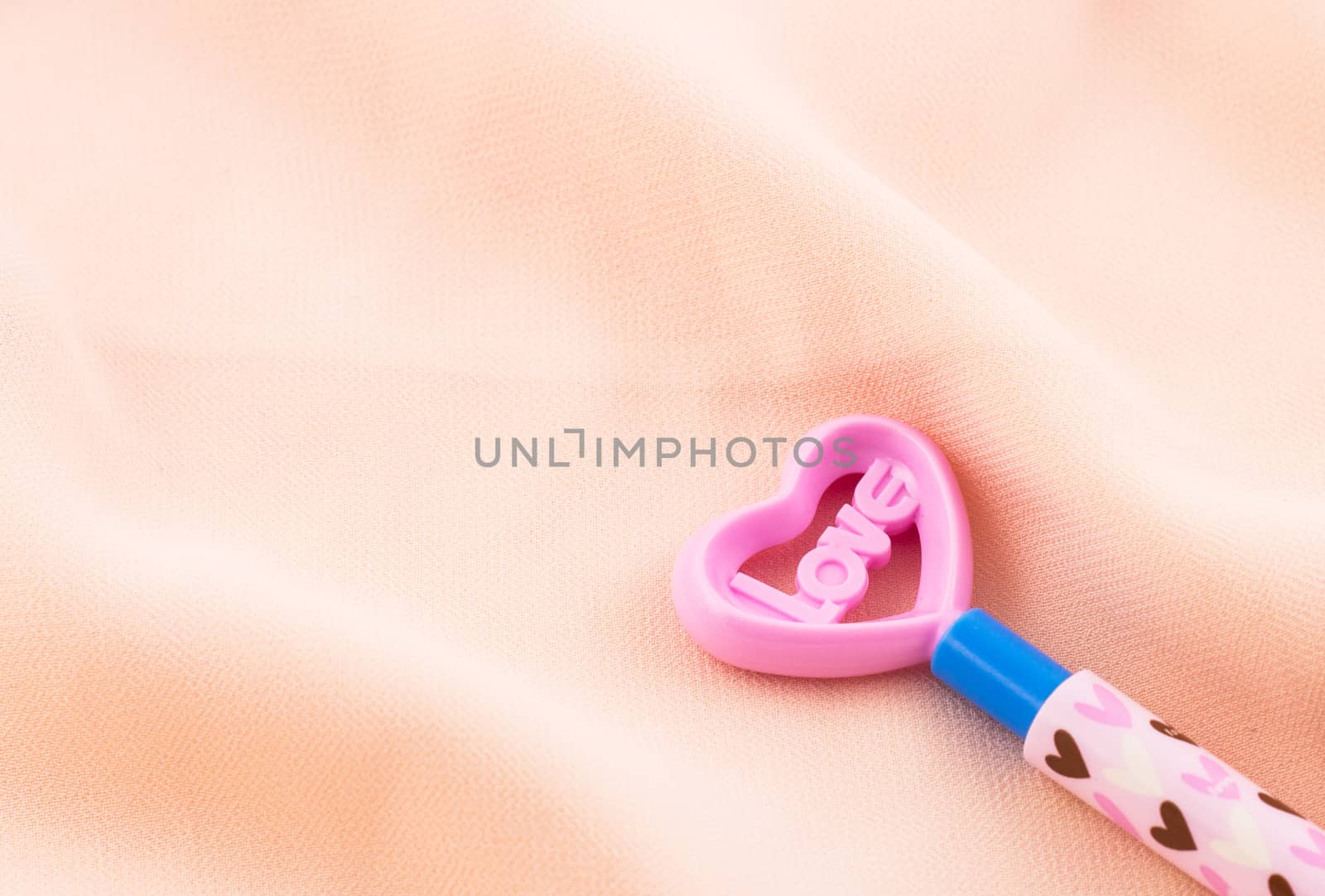 Love and haert symbol on pink background