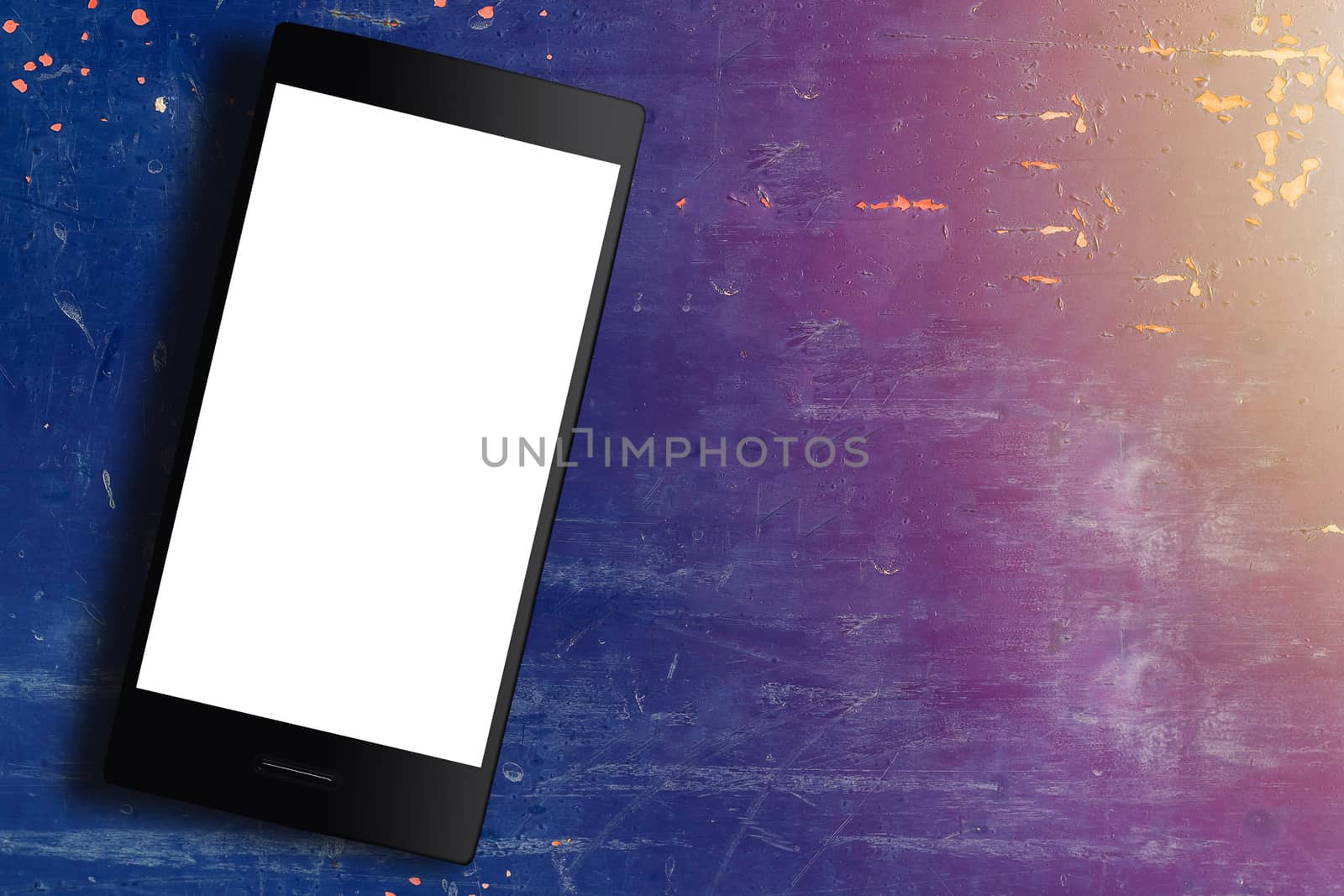Mobile phone on blue vintage background with copy space, sunlight, communication concept, 