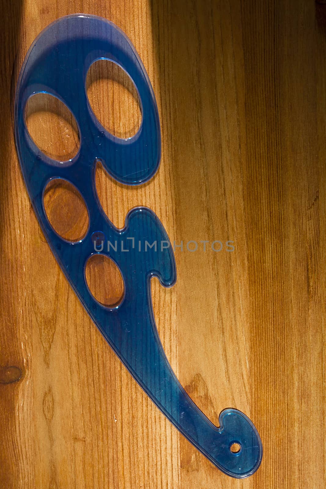 Plastic blue pattern on a wooden table